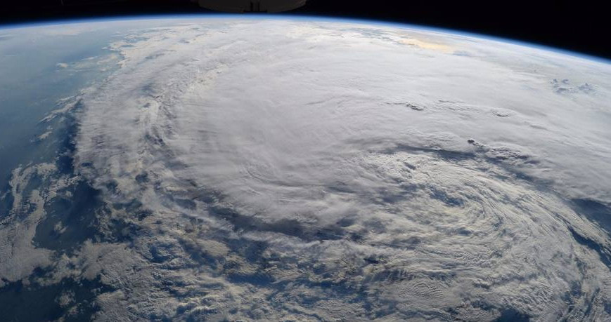 Hurricane Harvey from space. Black background of space. Swirling clouds completely obscure any landmasses.